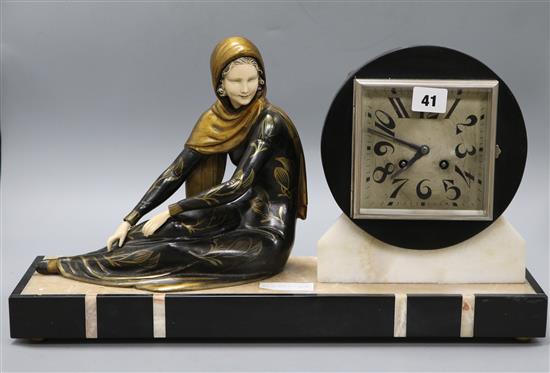 An Art Deco figural clock length 49.5cm